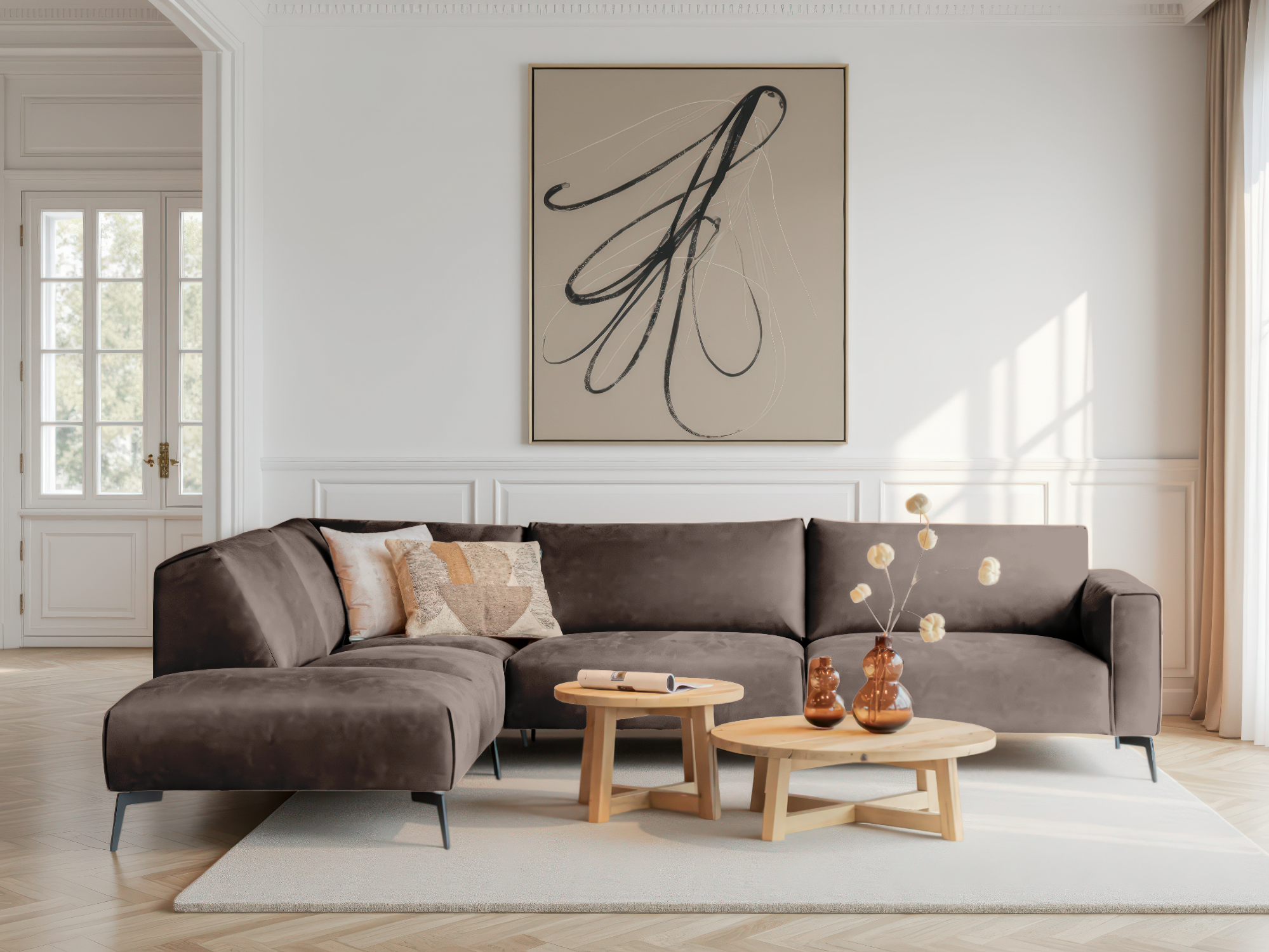 Hoekbank in taupe met brede armleuning en diepe zit