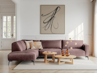 Oudroze hoekbank met fluweelachtige bekleding en afgeronde hoeken