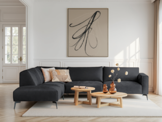 Antracietkleurige hoekbank met strakke vormgeving en diepe zitting