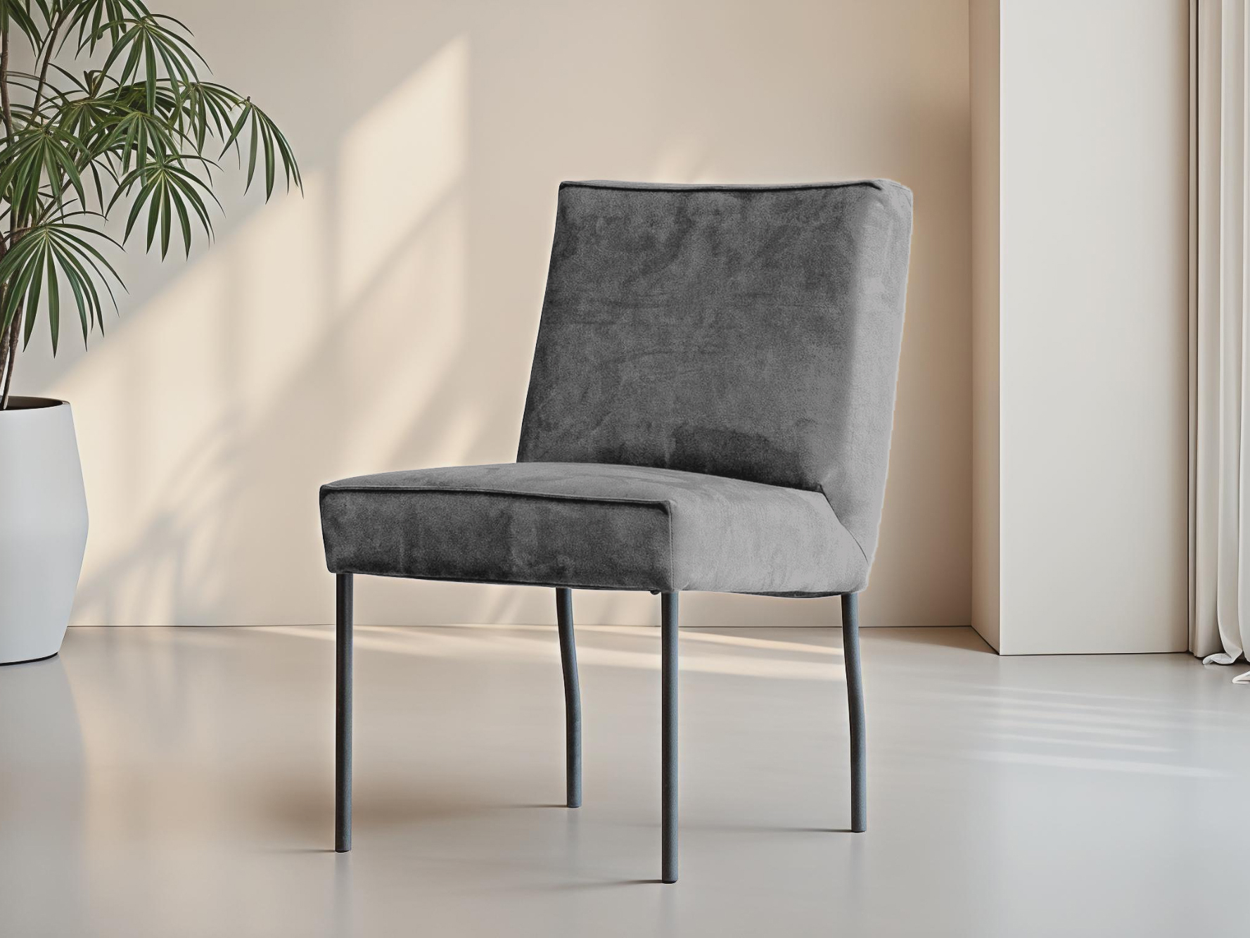 Elegante eetkamerstoel met smalle zwarte pootjes en comfortabele suède zitting