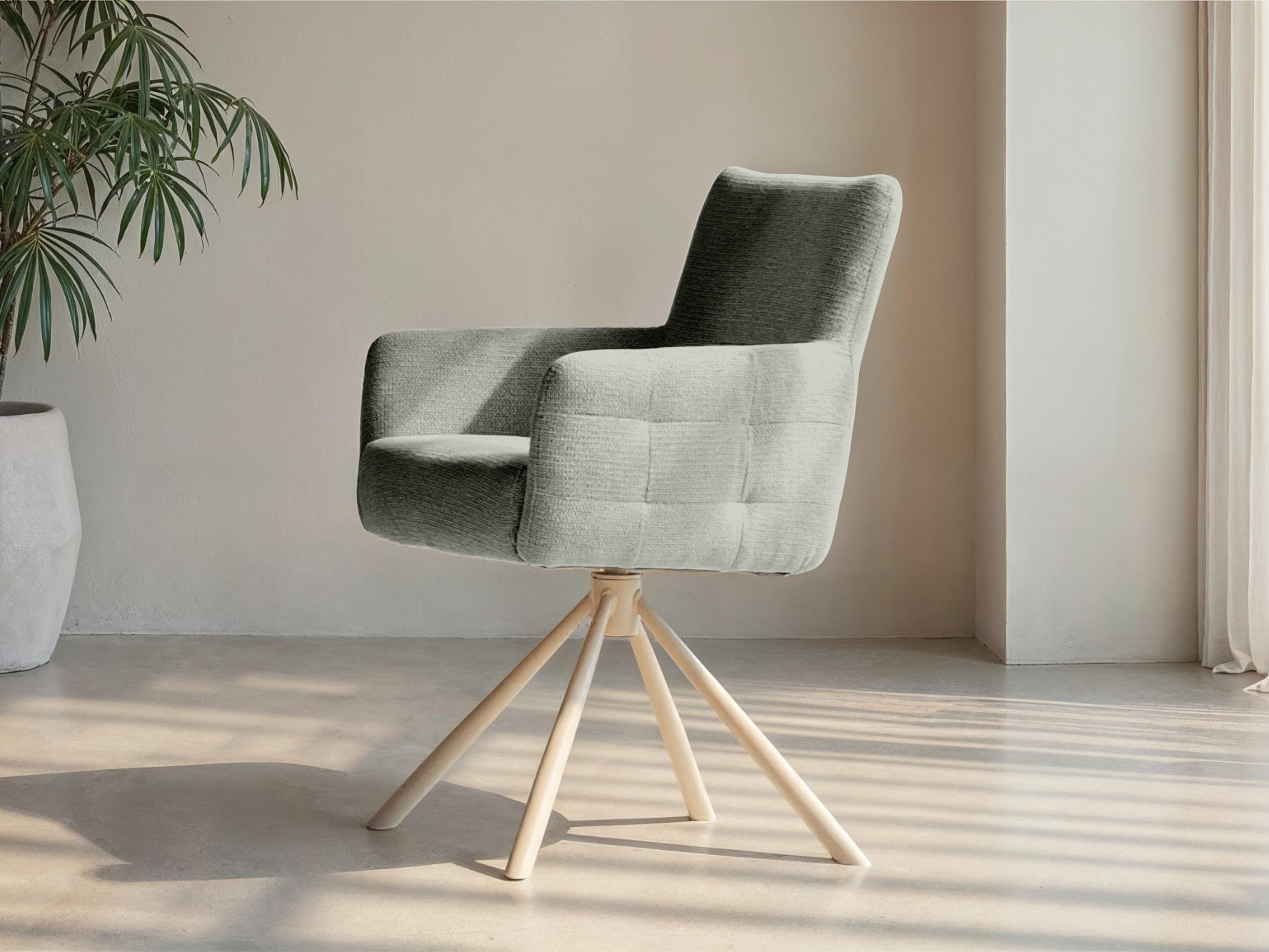 Eetkamerstoel met zachte grijze bekleding en uniek onderstel